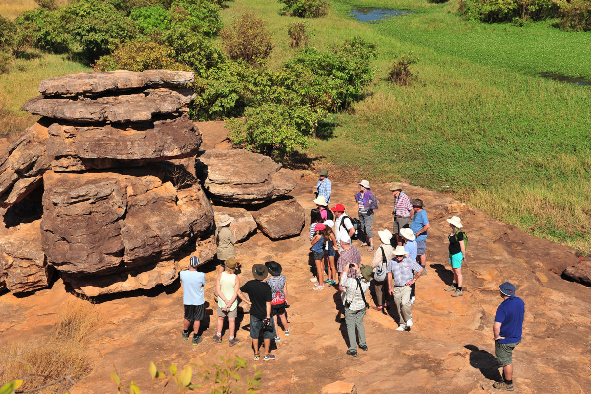 People admiring rock formation in Arnhemland on the 2 Day Kakadu Arnhem Land Tour