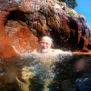 Man enjoying a refreshing swim at Litchfield National Park
